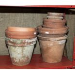 A collection of clay plant pots