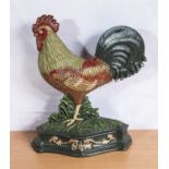 A cast iron cockerel door stop