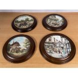 Four pottery wall plates