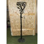 A wrought iron uplighter in need of re-wiring