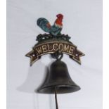A cast iron cockerel bell and hanger