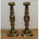 A pair of King of Diamonds brass candlesticks