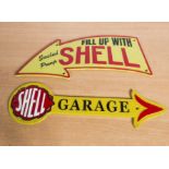 Two cast iron shell signs