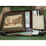 A box containing framed prints