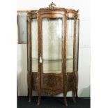 A French vitrine, shaped panels and door, ormolu mounts and five marquetry panels, nice condition.