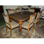 A late Victorian extending oak dining table and six chairs