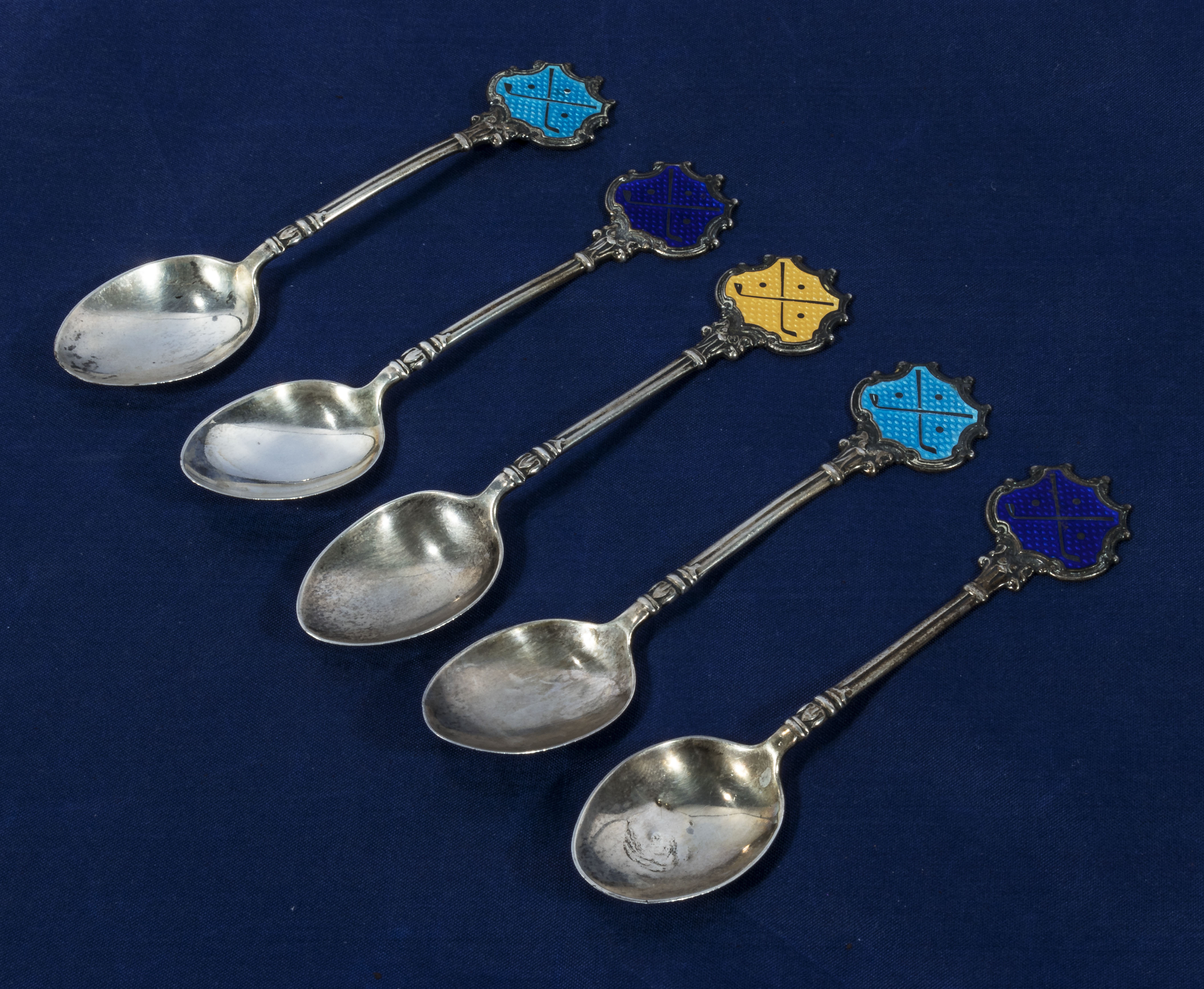 Five enamelled silver golf spoons, marked Bishop Auckland Golf Club, marks for 1930's 67gms