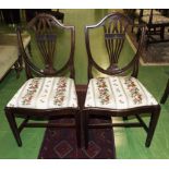 A pair of Georgian style chairs