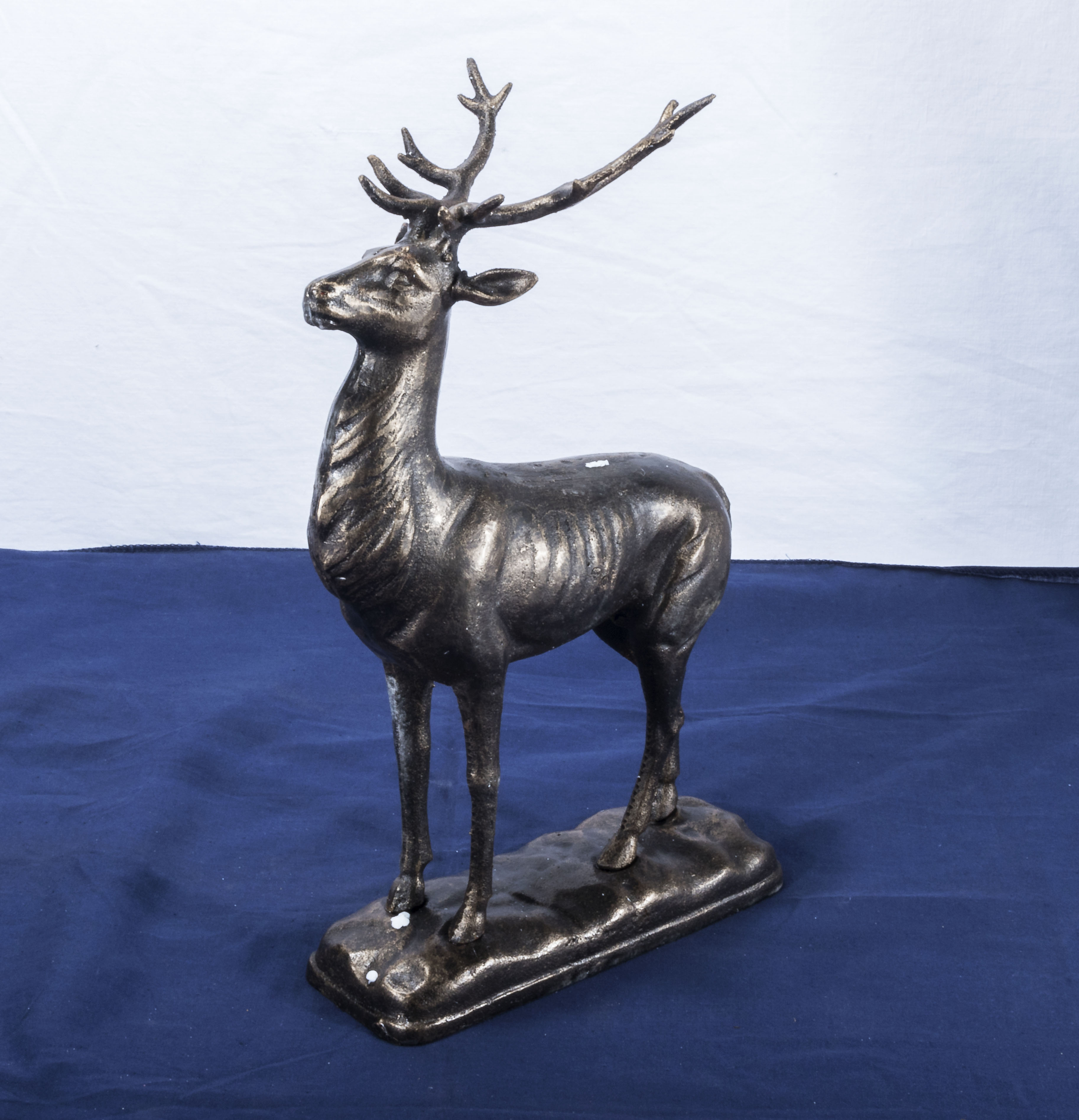 A cast deer on base