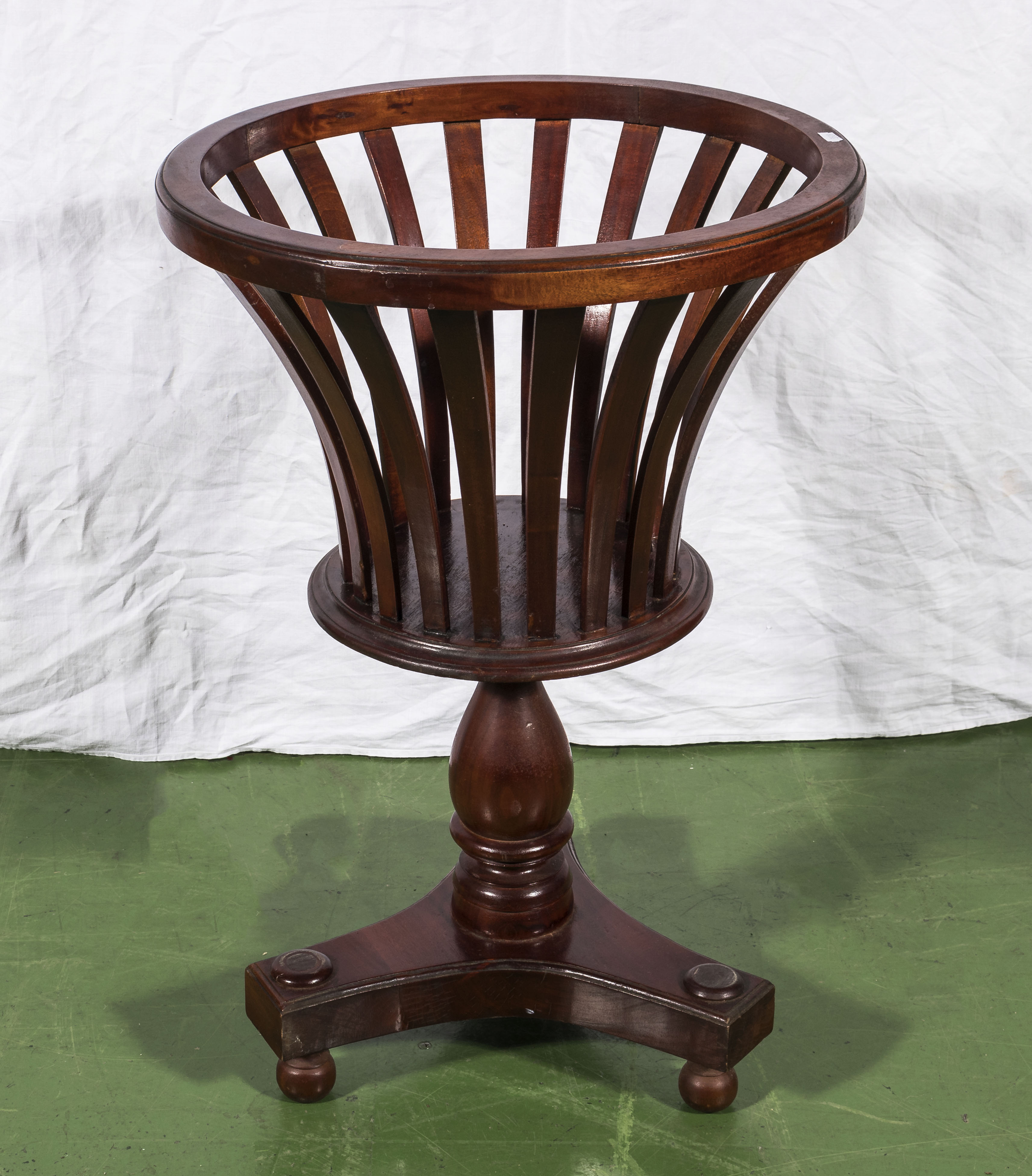 A Regency style mahogany plant stand.