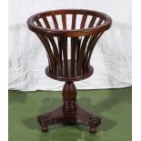 A Regency style mahogany plant stand.