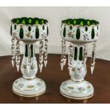 A pair of overlay glass lustres green glass with white overlay decorated with flowers.12inch high