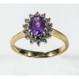 A lady's 18ct gold cluster ring set with amethyst and diamonds, weight 4gms, size P