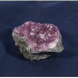 Cobalto calcite on rock