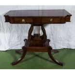 A reproduction mahogany side table in the Regency style.