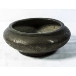 A Chinese Qing dynasty bronze censer decorated in relief