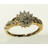 A lady's 9ct gold diamond cluster ring, size P