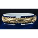 A Victorian 9ct gold bangle set with seed pearls, weight 12gms