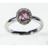 A lady's 18ct white gold pink sapphire and diamond cluster ring, 4gms, size M