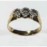 A lady's 18ct gold ring set with three diamonds, size P