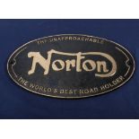 Norton black and gold plaque