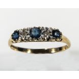 A lady's 9ct gold ring set with three sapphires and diamonds, size Q