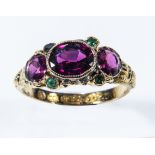 A lady's15ct gold ring set with amethysts and emeralds, size N