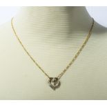 A 9ct gold pendant set with diamonds