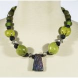 Unique designer necklace, recycled African glass , lava rock dried seeds and titanium quartz