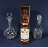 A bottle of Bell's 8 year aged whisky and two decanters