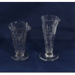 Two vintage glass medicine measures