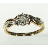 A lady's 9ct gold diamond cluster ring with diamond chips to shoulders, size N