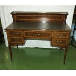 An Edwardian inlaid mahogany desk with leather insert