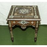 An eastern table inlaid with mother of pearl