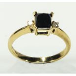 A lady's 9ct gold ring set with a sapphire and diamonds, size N