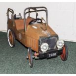 A vintage pedal car fire engine