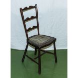 A child's ladder back chair