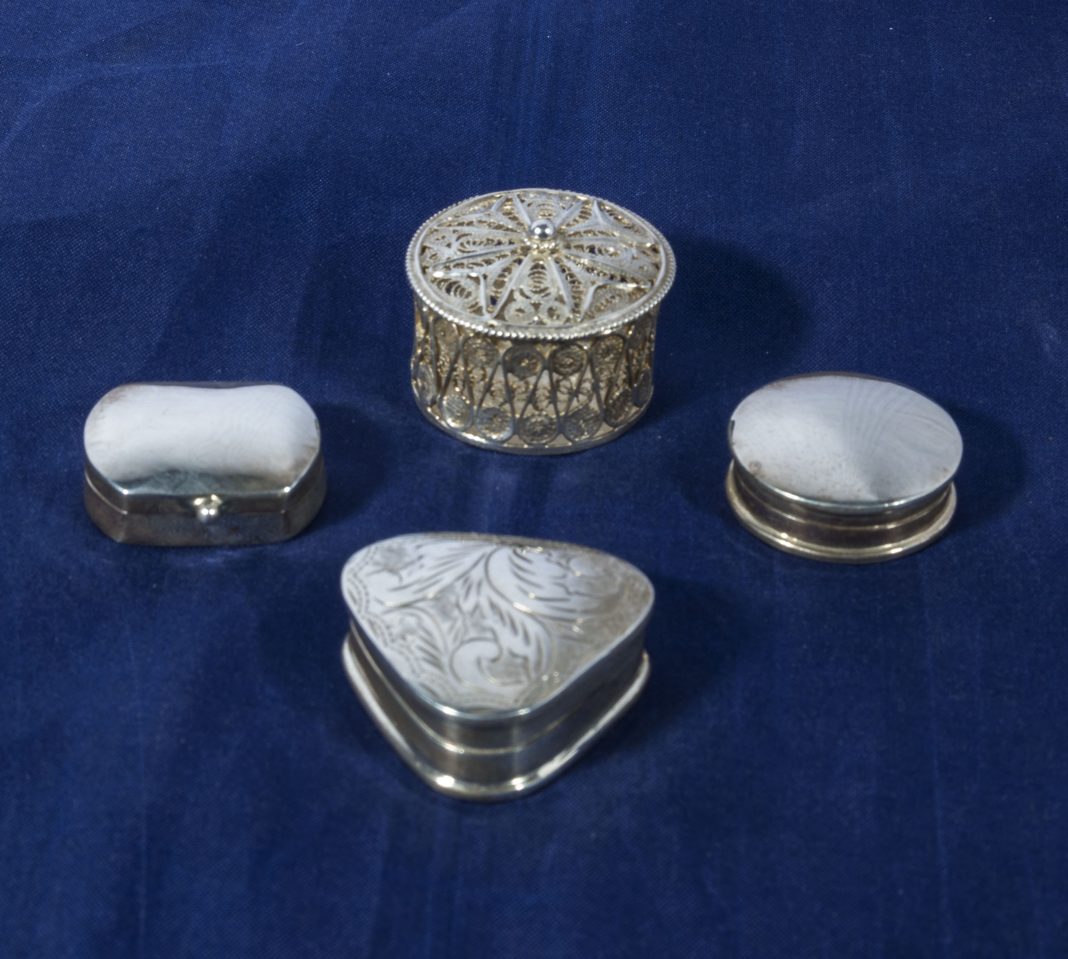 Four silver pill boxes