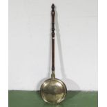 A brass warming pan