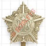 Machine Gun Guards white metal OR’s cap badge circa 1917-18. Die-stamped crowned GMR cypher in