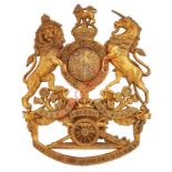 Royal Artillery OR's helmet plate circa 1902-14.A good die-stamped brass example. Royal Arms over "