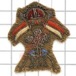 12th Royal Lancers Officer’s gold wire embroidered beret badge circa 1940-52.Khaki backing.VGC