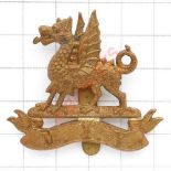 Welsh. Montgomeryshire Imperial Yeomanry OR’s brass cap badge. Die-stamped Dragon on scroll