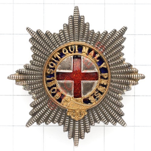Coldstream Guards Warrant Officer’s cap star. A fine cut silvered example; the gilt Garter pierced