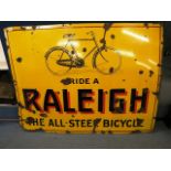 A Raleigh enamel pictorial advertising sign, 47 3/4 x 36