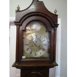 A Georgian oak long case clock with arch brass dial by William Hall