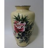 A signed Japanese Ando cloisonné vase decorated with a floral design on a cream ground, circular