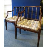 A pair of Georgian mahogany armchairs with Adams style shaped splats, later seals standing on square