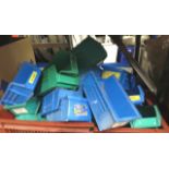 A large quantity of plastic storage boxes