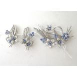 White metal Ceylon sapphire and diamond cluster flower head, leaf and bow brooch and matching ear